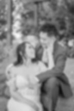 bride and groom sitting and looking at each other