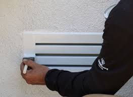 Person holding a stack of books