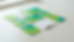 Top-down view of printed agricultural training guides on a plain work surface.