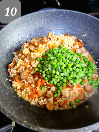 When the risotto is nearly ready, add the frozen green peas, stirring until they are heated thoroughly.