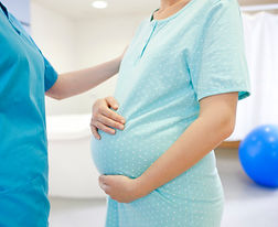 Pregnant woman and nurse