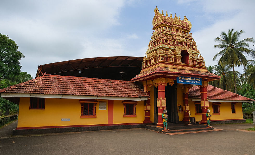 Sri Bhagavathi Temple in Sasihithlu, Karnataka, with its ornate gopuram, red-tiled roof, and coconut palms in the background.