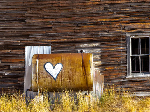 Heart painted on a tank outside of an abandoned dance hall