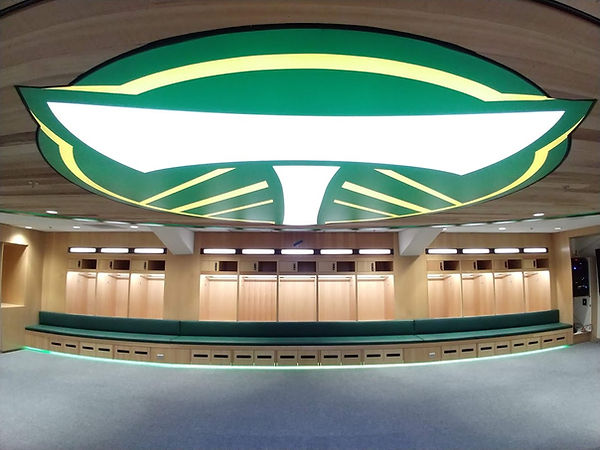 This image is of the Portland Timbers Locker Room with upholstery by Ankor, green upholstery bench seating