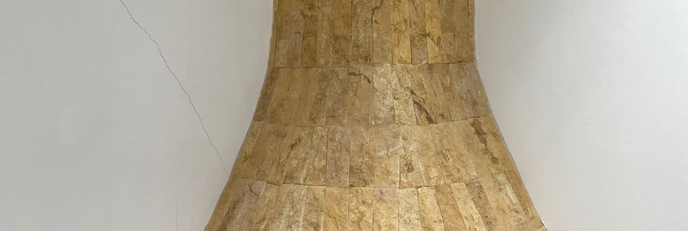 Close-up view of the fireplace in a stone-built house for sale in a traditional village on Crete. The rustic charm and intricate details of the fireplace add warmth and character to this inviting Cretan property.