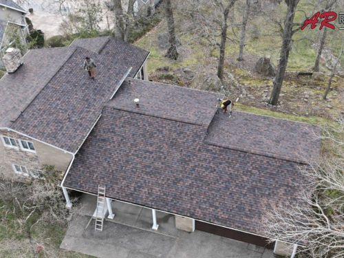 Putting the finishing touches on this roof installation in Hopwood, PA