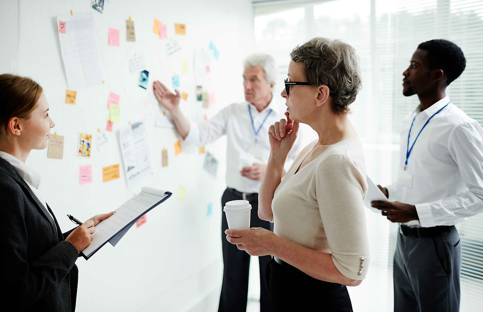 Woman at mind mapping board at a Best Strategic Planning Session with Tom Iselin