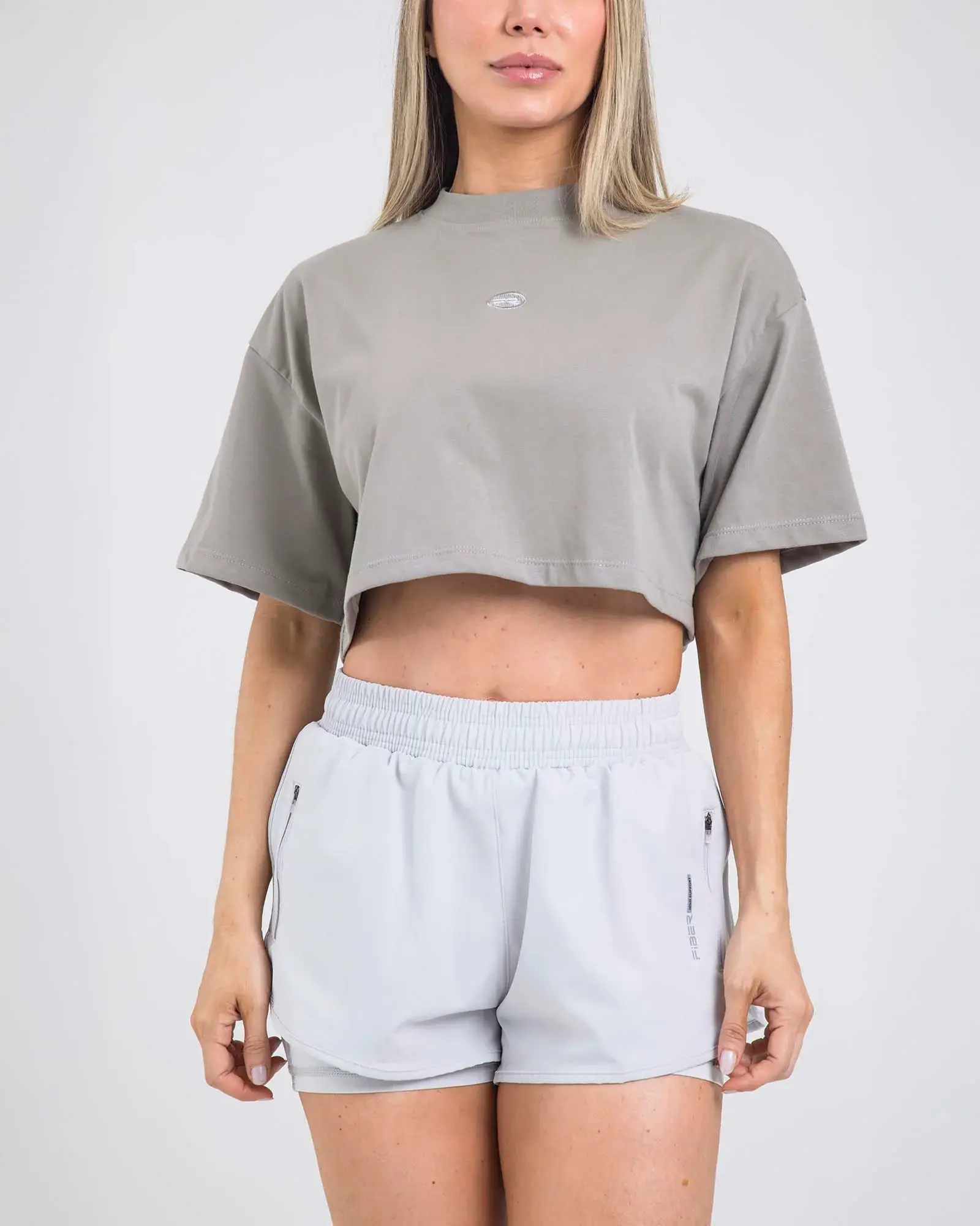 BLUSA CORTA APERTURA TRASERA GRIS - FIBER OUTDOOR