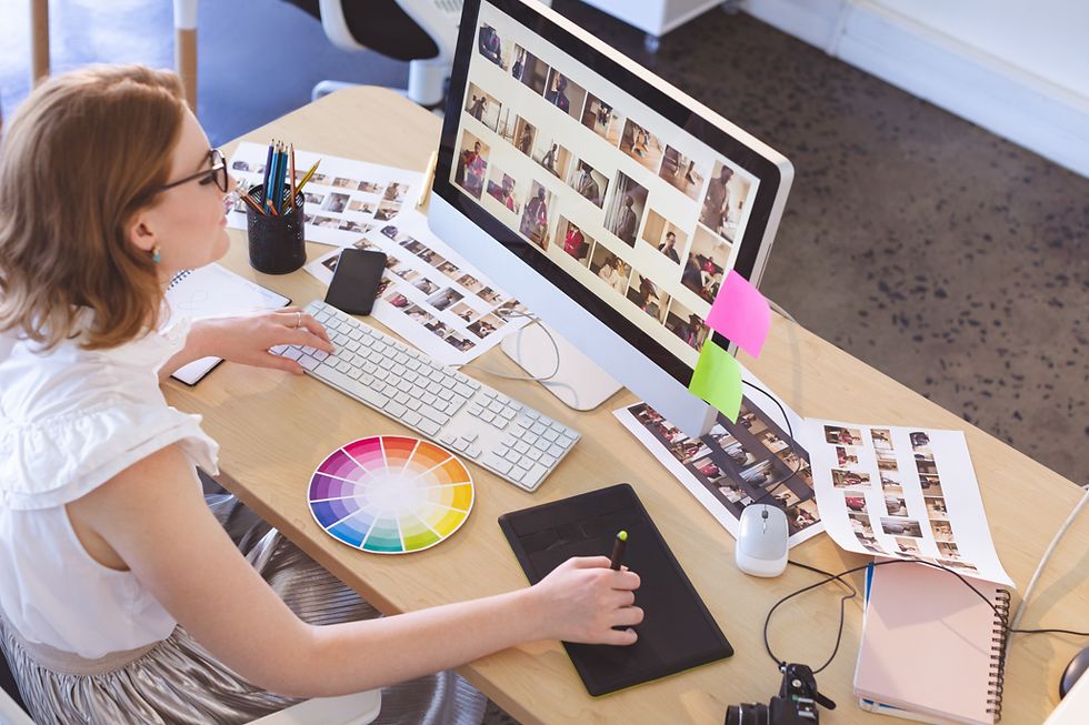 designer using computer to work on graphic design work