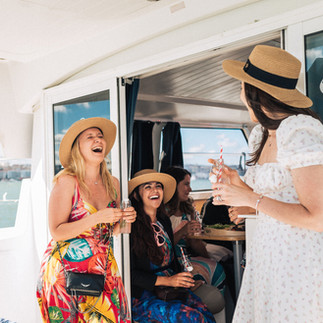 Lisbon boat tour experience with people celebrating onboard