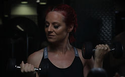 female personal trainer in Cambridge doing bicep curls