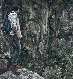 Hiker Facing Cliff