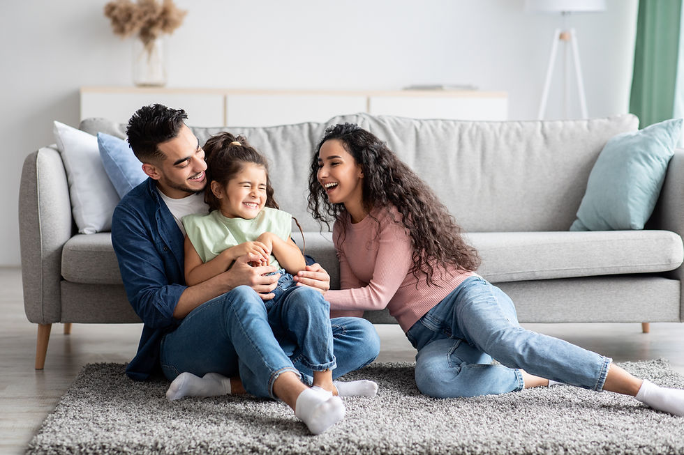Parents playing with their daughter