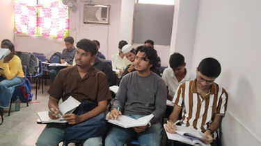 Students listening and learning in a classroom at spark academy.