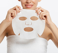 young-girl-with-facial-mask-looking-camera-white-background-cosmetic-procedure-beauty-spa_