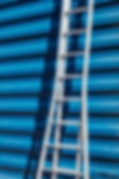 Ladder Against Blue Wall