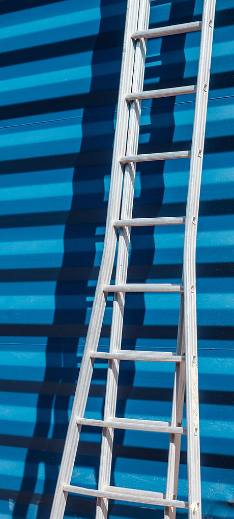 Ladder Against Blue Wall