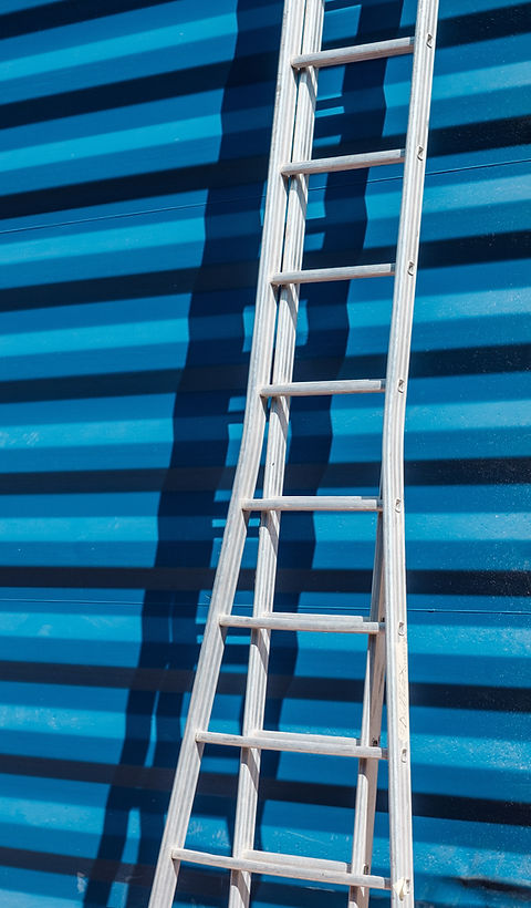 Ladder Against Blue Wall