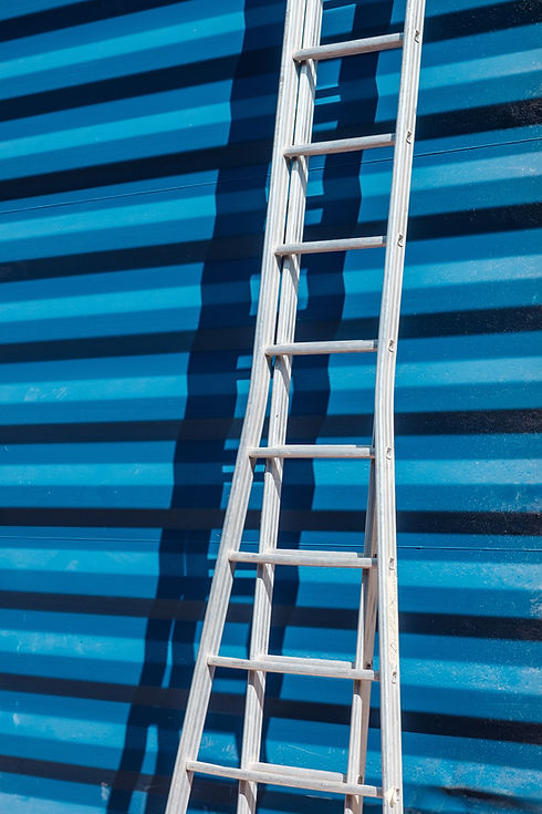 Ladder Against Blue Wall