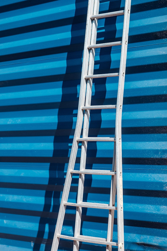 Ladder Against Blue Wall