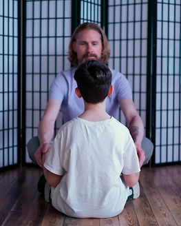 A man looking at a teenage boy