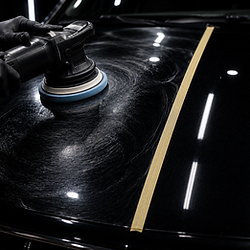 Two-step paint correction on a black car hood