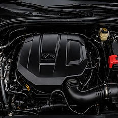Clean V6 engine bay detail after professional cleaning.