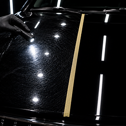 Flashlight highlighting scratches vs two-step paint correction.