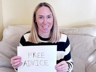 Virginia Peninsula Realtor Ashley Clevenger holds sign that says Free Advice