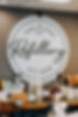 Wall art of One Drop Refillery logo, table with non-toxic, eco-friendly bar soaps, laundry detergent, and other products