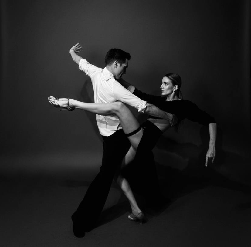 Two dancers in a dynamic pose, personalized movement training