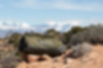 This is an image of the Portage Duffel bag sitting on the ground at a campsite.