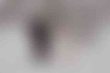 Bride and groom having a first look on their snowmobile elopement during a snowstorm in Ridgway colorado