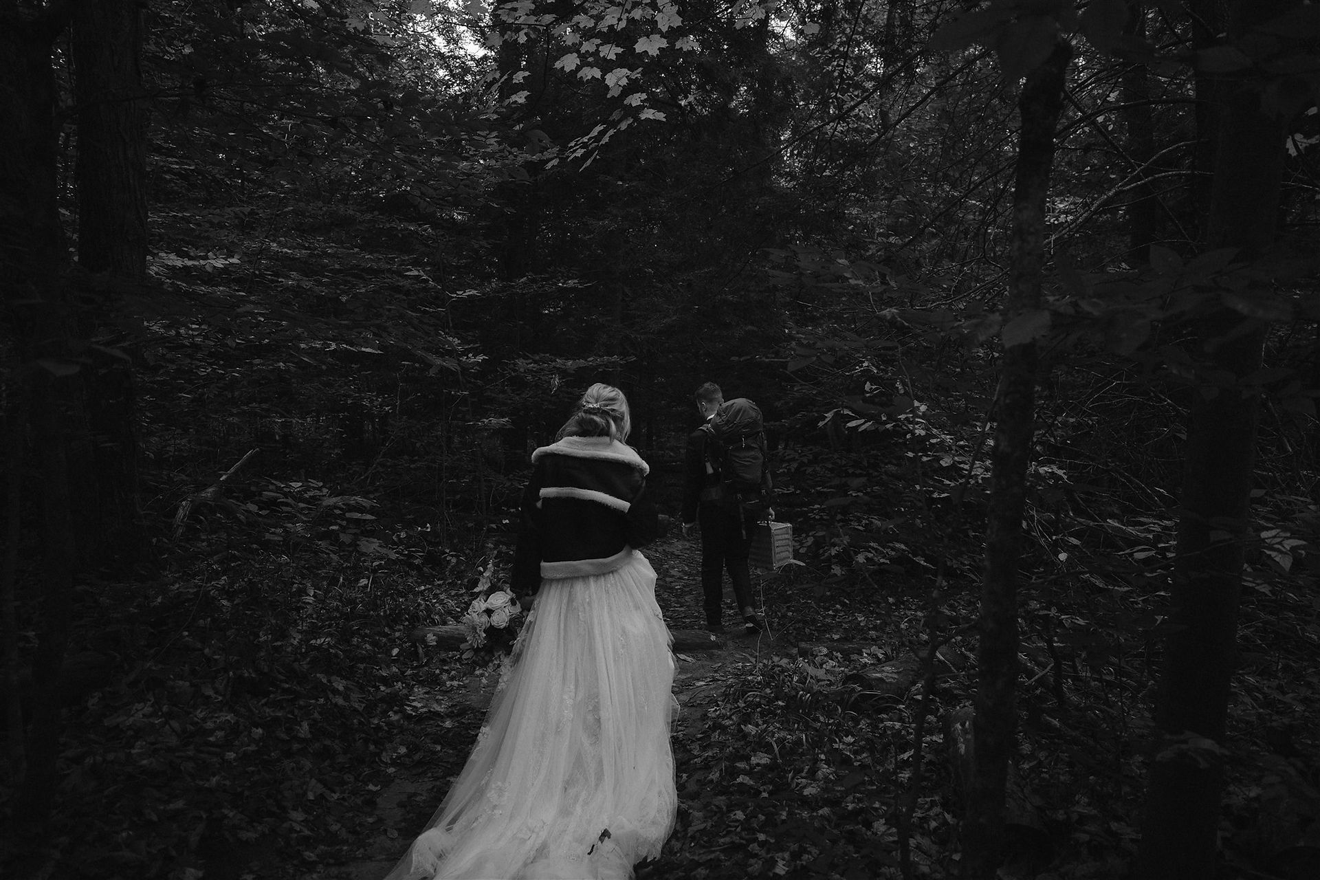 Eloping couple hiking in hocking hills on their conkles hollow elopement day