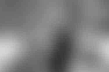 Bride and groom snowmobiling on their snowmobiling elopement