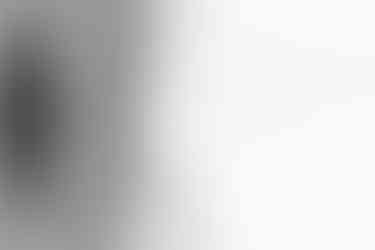 black and white image of a wedding dress with pearl detail touches to the embroidery