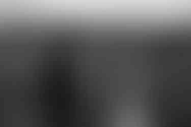 Eloping couple reading their vows on the cliffs of conkles hollow on their hocking hills ohio elopement day in fall behind them you can see the conkles hollow fall foliage