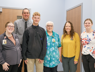 Ellinwood Hospital Therapy Services Team with Patient Trace Ritterhouse