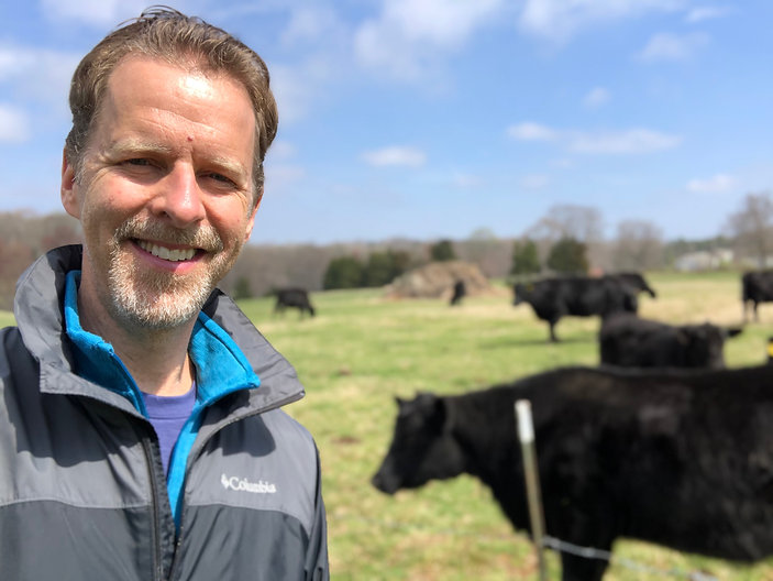 mike with cows.jpeg