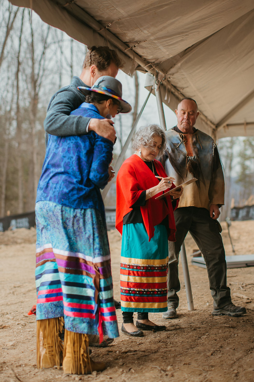 Founder Mike Marburg with Sanctuary on the Trail’s Chris “comeswithclouds” White and Rene Locklear White, stand with Dr. Cherry Beasley, Director of the Lumbee Health and Human Services Department (Photo Credit: Hilary Hyland)