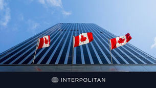 Canadian flags on the outside of a corporate building