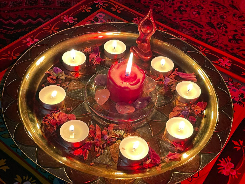 alter with candle and goddess at a red tent women circle