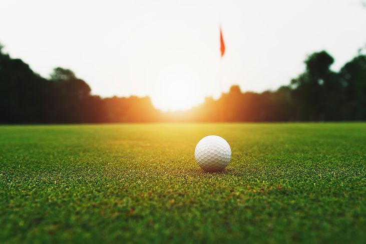 vecteezy_golf-ball-on-green-grass-with-hole-and-sunlight_8701270.jpg
