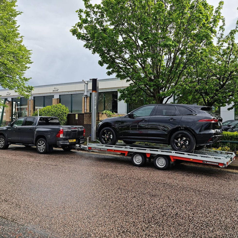 Black SUV on car transporter