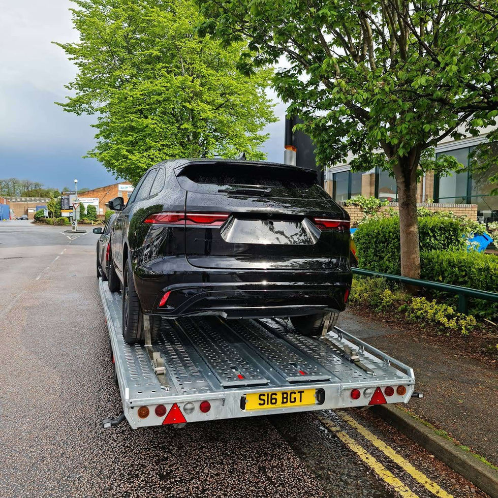 Black SUV on car transporter, BGT