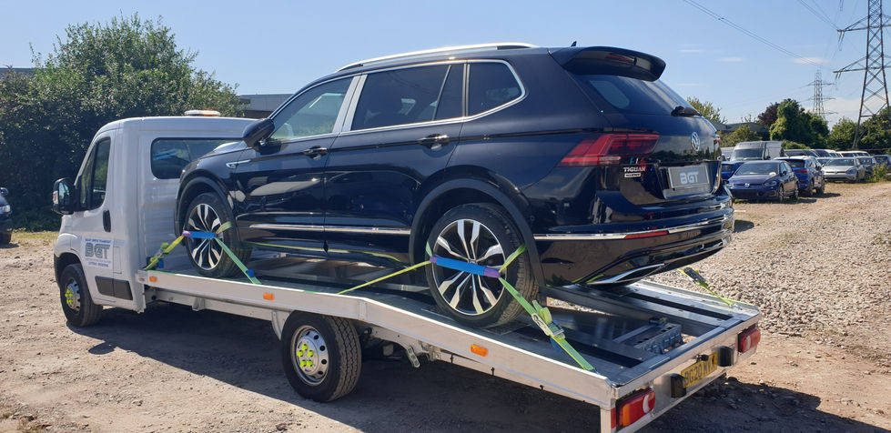 Black Volkswagen Tiguan on car transporter