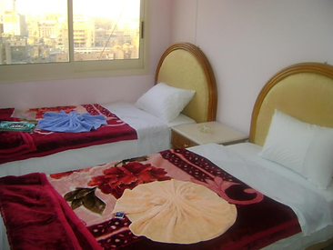 Charming poolside bar at a three-star hotel serving refreshing drinks and snacks. Book your accommodation in Cairo to enjoy a