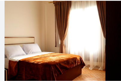 Hotel Rooftop View: "Stunning rooftop view from a three-star hotel in Cairo, showcasing the city skyline and historic landmar