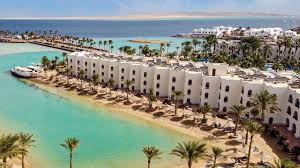 "Hurghada hotel gym, equipped with modern workout machines and a view of the ocean for fitness enthusiasts."