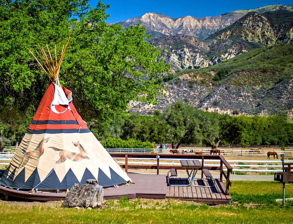 Tipi at Rancho Oso that sleeps up to 4 people on army cots